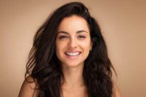Woman smiling with smooth, youthful skin from FaceTite in La Jolla, CA