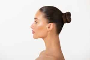 Side profile of a woman with a beautiful nose after rhinoplasty in La Jolla, CA